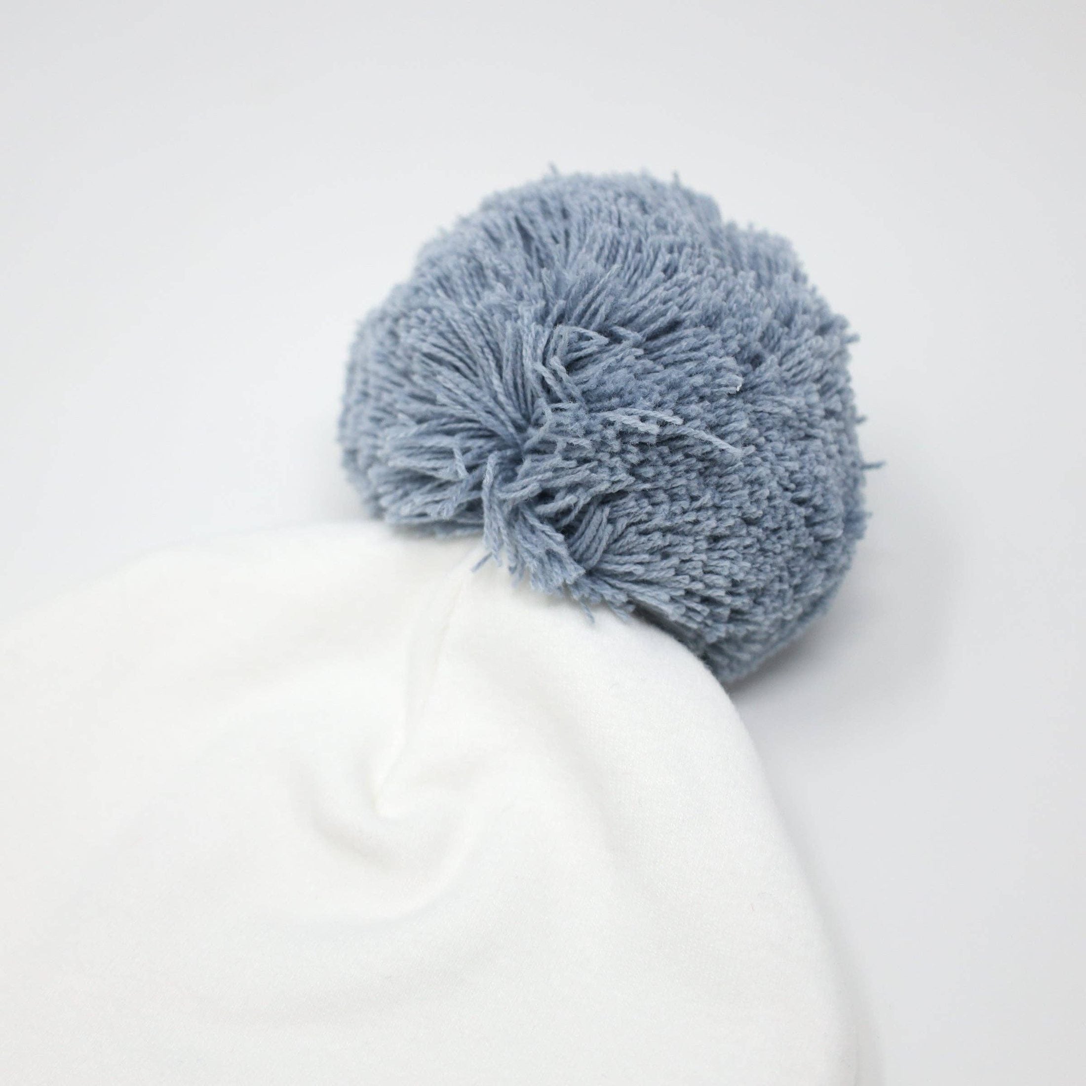 White Newborn Hat with Blue Pom-Pom